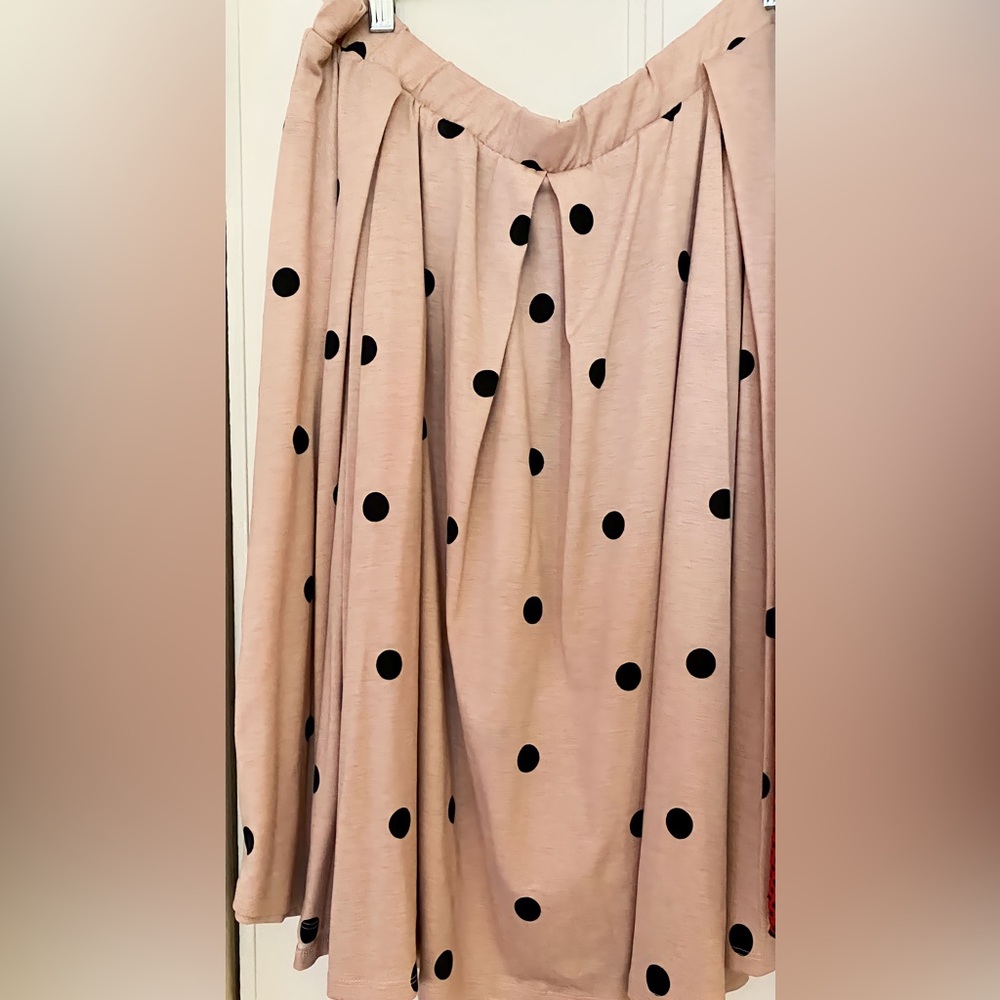 A beautiful pink skirt with black polkadots size 2 XL with  tags.